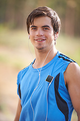 Image showing Music player, portrait or or happy man running with earphones in outdoor exercise or fitness workout. Runner, nature or athlete listening to playlist for streaming radio, podcast or sports training