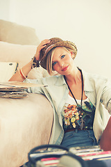 Image showing Woman, hat and record with portrait, retro and living room floor for relaxation. Person, couch and vintage for hobby, happiness and stress relief with trendy music and summer recreation with style
