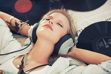Image showing Relax, music and woman with headphones on floor for streaming subscription, audio and radio. Podcast, smile and above of person listening to playlist, song and track in home with vinyl records
