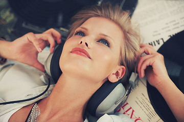 Image showing Vinyl, music and woman with headphones on floor for streaming subscription, audio and radio. Podcast, happy and above of person listening to playlist, song and track for relaxing in home with records