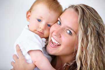 Image showing Happy mother, portrait and hug with baby for love in care, trust or bonding together on holiday at home. Face of mom or little toddler with smile for family, childhood or motherhood in relax at house