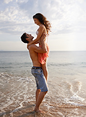 Image showing Embrace, waves and couple playing on beach for travel adventure, summer island holiday and relax. Ocean vacation, woman and man in nature on romantic date together with smile, love and sea in Bali.