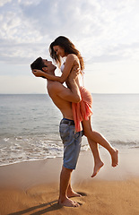 Image showing Love, waves and couple playing on beach for travel adventure, summer island holiday and relax. Ocean vacation, woman and man in nature on romantic date together with smile, embrace and sea in Bali.