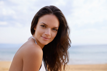 Image showing Beach, smile and portrait of woman in nature on tropical vacation, adventure or holiday. Happy, travel and young female person with positive attitude by ocean on summer weekend trip by island.