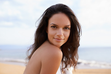 Image showing Beach, sea and portrait of woman on tropical vacation, adventure or holiday for travel. Happy, nature and young female person with positive attitude by ocean on summer weekend trip by island.