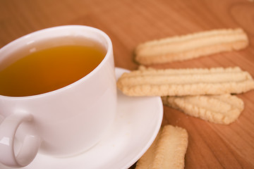 Image showing cup of tea and some cookies