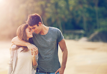 Image showing Couple, holding hands and hug on beach date in outdoors, love and bonding in relationship on vacation. Happy people, embrace and support in marriage on weekend, sunset and walking on sand for travel