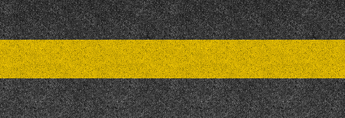 Image showing Black asphalt background texture with yellow line. Banner