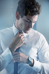 Image showing Thinking, tie and getting ready with business man in studio on white background for start of career. Corporate, company and professional with young professional employee dressing for work interview