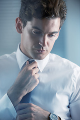 Image showing Face, thinking and getting ready with business man in studio on white background for start of career. Corporate, company and professional with serious young employee dressing for interview at work