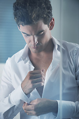 Image showing Morning, shirt and business man getting ready in bedroom of home for start of career or work. Corporate, fashion and dressing with button on sleeve of young employee in apartment for professional job