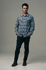 Image showing Man, portrait and fashion with denim jeans, clothes or style on a gray studio background. Male person, adult or young model with casual clothing, shirt or stylish outfit in confidence on mockup space