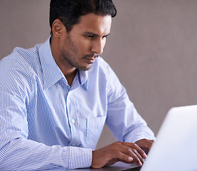 Image showing Businessman, laptop and email by desk for productivity and online research on company in office. Entrepreneur, computer or technology for small business website or networking for startup development