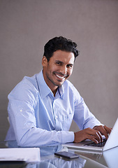 Image showing Businessman, laptop or happy portrait by desk for social media or online research in office. Entrepreneur, computer or technology for small business website, productivity or typing in startup company