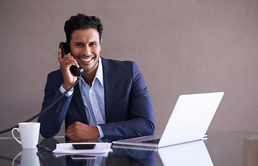 Image showing Phone call, laptop and portrait of business man in office with telephone for networking, communication and talking. Consultant, corporate and worker on computer for internet, website and planning