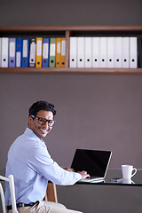Image showing Office, clerk and happy portrait of man with laptop for administration, files and professional report. Corporate, employee and businessman with a smile for working on portfolio, update or project