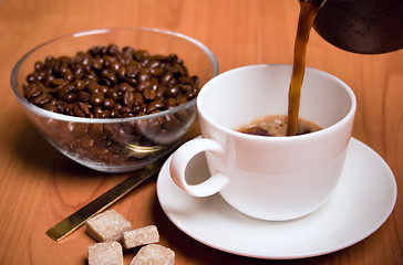 Image showing cup of coffee, sugar and beans