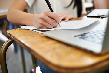 Image showing Person, laptop and studying or writing for information, reading and connection for assignment in university. Student, scholarship or computer in college by desk, notes or online research for learning