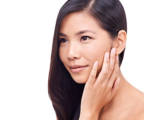 Image showing Asian woman, thinking and studio with soft skin for beauty, smile and cosmetics for skincare or routine. Wellness, closeup and hand to feel healthy face with dermatology isolated on white background