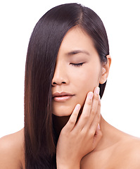 Image showing Asian woman, face and hand with studio, haircare and cosmetic for treatment or care. Japanese model, hair style and beauty with confidence, aesthetic and wellness isolated on white background