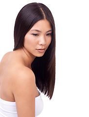 Image showing Woman, hair treatment and cosmetics for beauty in studio, growth and pride for keratin on mockup space. Asian female person, shampoo and conditioner for health, white background and dermatology