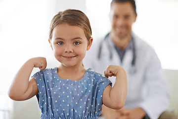 Image showing Pediatrician, young girl and arm with flex for strong, brave and happiness for treatment. Doctor, smile and child at clinic with success for test results, consultation and healthy immune system