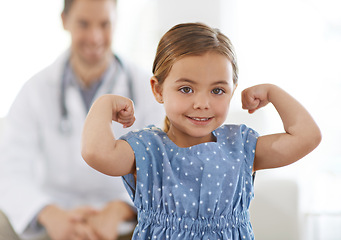 Image showing Pediatrician, child and arm with flex for growth, brave and strong with happiness for treatment. Doctor, smile and child at clinic with success for test results, consultation or healthy immune system