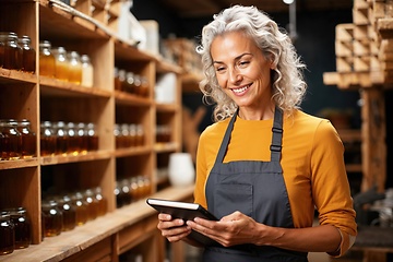 Image showing Confident Female Artisan with Digital Tablet in Workshop