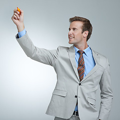 Image showing Businessman, planning and writing on glass with pen in studio with ideas or strategy for future. Professional, brainstorming and man problem solving on window or screen with marker in hand for mockup