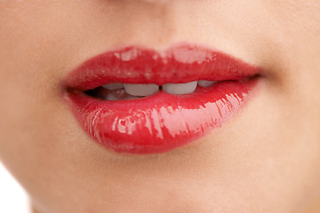 Image showing Person, red lipstick and closeup of mouth with makeup for cosmetics, gloss or glow in treatment. Colorful lips of woman or model with bite in satisfaction for mouth, oral or beauty in cosmetology