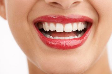 Image showing Woman, teeth and red lipstick with makeup for beauty, cosmetics or dental care on a white studio background. Closeup of female person or model with lip gloss, glow or tooth whitening in dermatology