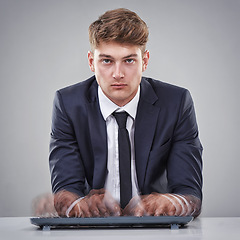 Image showing Portrait, hand or businessman for busy, stress or overworked by typing, quick or keyboard in studio. Man, mental health or burnout in corporate, business and fast for office work on grey background