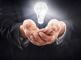 Image showing Hands, light bulb glow and idea for business growth, development and professional problem solving. Person with insights, corporate innovation and knowledge with enlightenment and inspiration