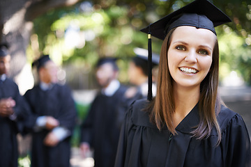Image showing Student, portrait and graduation with smile and woman outdoor at university, college and achievement ceremony. Education, campus and class at certificate, degree and school event for diploma in park