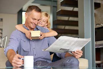 Image showing Man, daughter and gift for fathers day in home, happy and present for gratitude or appreciation. Daddy, child and smile for love and care in package for birthday, hug and reading newspaper with tea