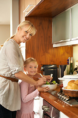 Image showing Mother, daughter and cooking a salad in portrait, happy and kitchen for healthy meal in home. Girl, mommy and support in learning for child development, love and bonding with nutrition and vegan diet