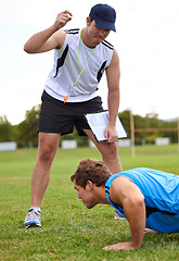 Image showing Men, push up and personal trainer on grass for fitness with clipboard for stats, progress or development. Person, coach or mentor with motivation for results, training or workout for health on field