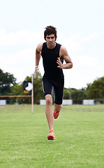 Image showing Athlete man, run and outdoor for race, jog and activewear in workout and training for wellness and portrait motion. Cardio, wellbeing and sport for exercise, health and fitness on grass for summer