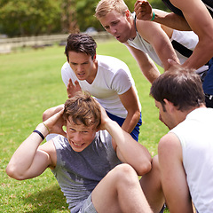 Image showing Man, sit ups for fitness and cheers from team with support and coaching, exercise and training on sports field. Challenge, action and core workout outdoor with athlete friends, motivation and help