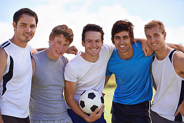 Image showing Soccer, men and together in portrait on field at game with fitness, exercise or happy with hug. People, teamwork and embrace with pride for support, solidarity or football with friends in competition