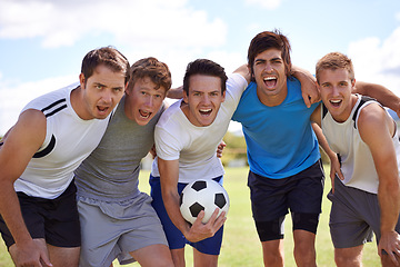 Image showing Soccer, men and hug in portrait with group at game for fitness, exercise and happy with sport. People, teamwork and embrace with pride for support, solidarity or football with friends in competition