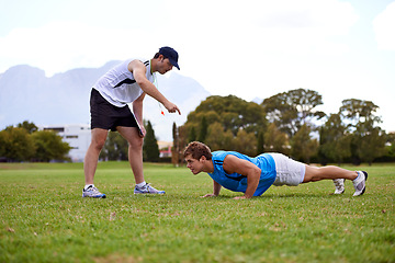 Image showing Men, push up and personal trainer on grass for workout with clipboard for test, progress or development. Person, coach or mentor with motivation for results, training or exercise for health on field
