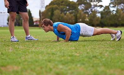Image showing Men, push up and personal trainer on field for exercise with counting for stats, progress or development. Person, coach or mentor with inspection for balance, training or workout for health on grass