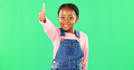 Image showing Little girl, face and thumbs up on green screen for good job, approval or success against studio background. Portrait of African American child or kid showing thumb emoji, yes sign or like on mockup