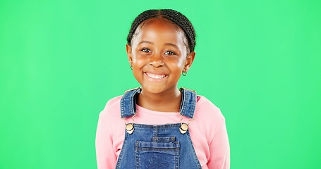 Image showing Child face, smile and studio with green screen and a happy girl feeling cute and sweet. Isolated, youth and background with a portrait of a little kid model with casual fashion and children clothes