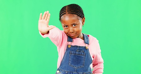 Image showing Stop, green screen and child with angry hand gesture for authority isolated against a studio background. Girl, frustrated and serious kid with a problem and no sign, signal and warning expression