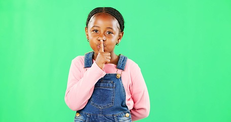 Image showing Face, secret and black girl with finger on lips, silence and happiness against studio background. Portrait, African American female child and young person with gesture for quiet, kid and green screen