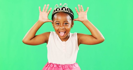 Image showing Children, playful and princess with a black girl on a green screen background in studio feeling silly or goofy. Kids, cute and happy with an adorable little girl playing or having fun on chromakey