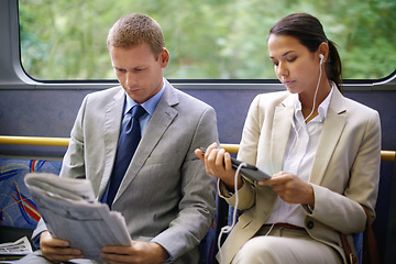 Image showing Bus, business people and commute to work on transportation, reading newspaper and tablet for info. Woman, earphones and online for social media or travel, newsletter and man for article on transit