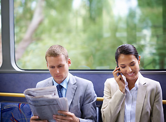 Image showing Bus, business people and commute for communication or news, reading newspaper and phone call for info. Woman, networking and app for conversation or travel, newsletter and man for article on transit